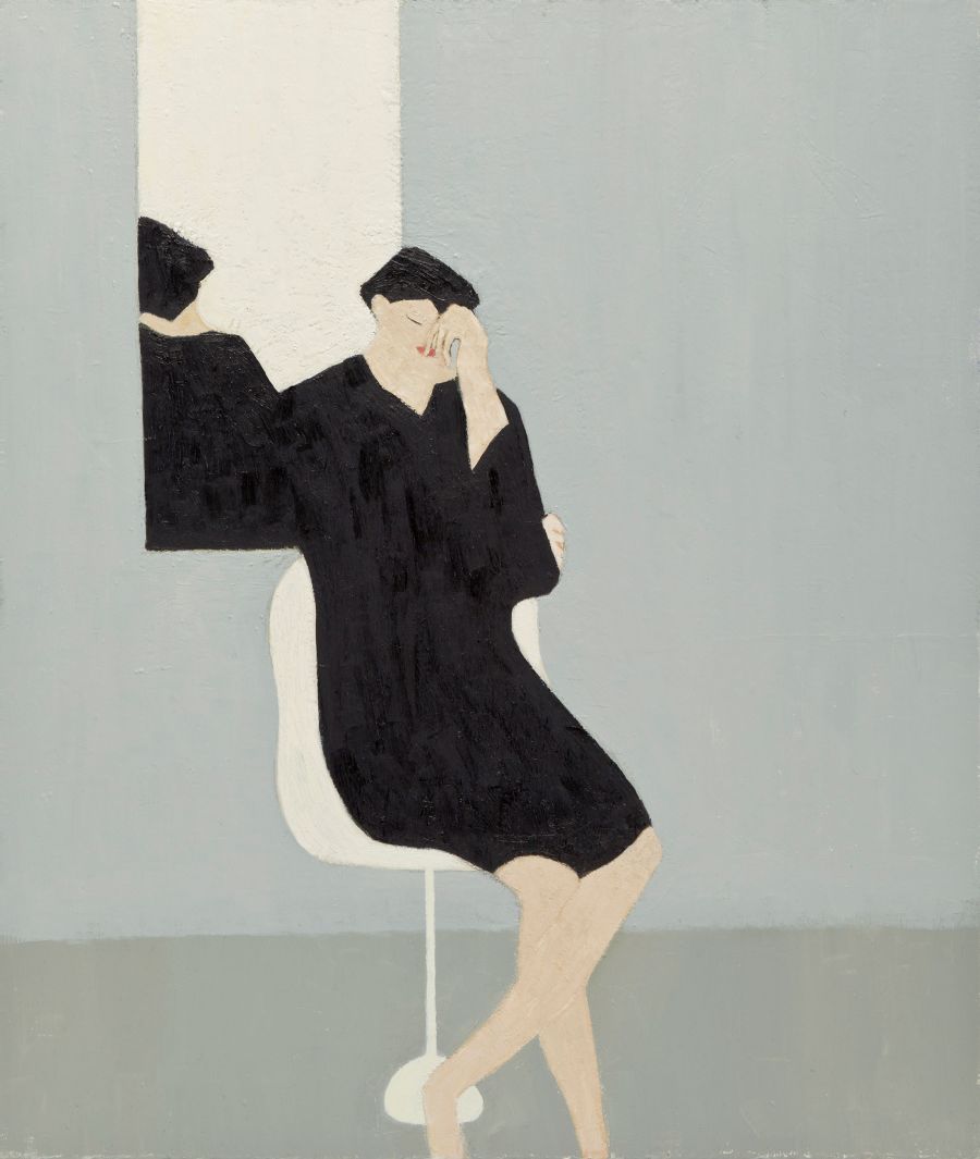 person sitting on white chair in front of mirror either asleep or thinking.