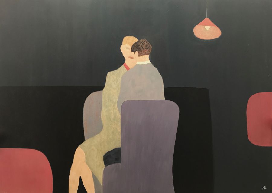 two people sitting on blue chairs.