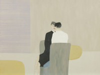 Two figures seated closely on grey chairs.