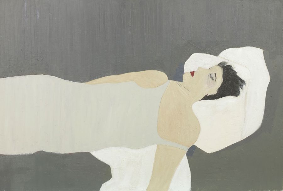 person lying against a white pillow.