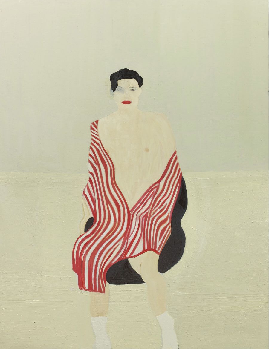 figure wrapped in red striped blanket.