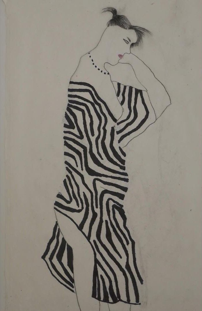 person wrapped in stripey blanket.